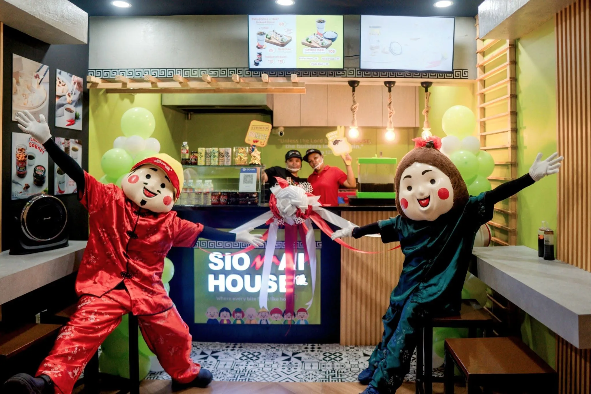 Siomai House mascots welcoming guests inside a newly opened branch